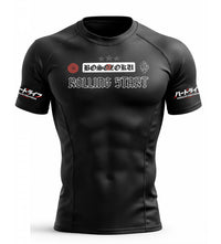 Black BJJ rash guard with rolling start branding on a white background