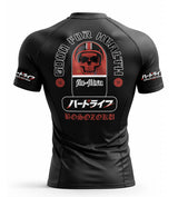 Black bjj rash guard with graphic design and text on a white background